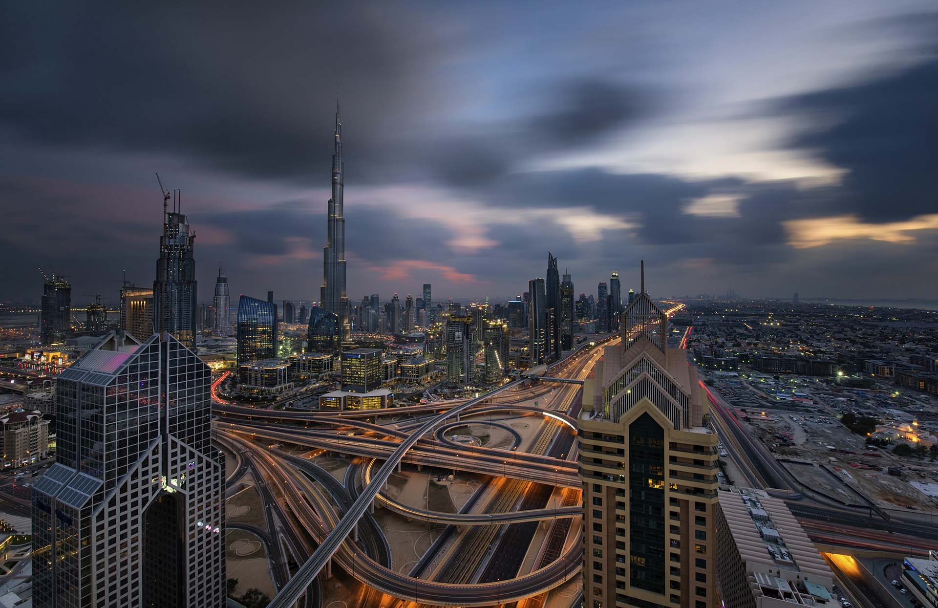 Cityscape of the Dubai, United Arab Emirates, with the Burj Khalifa and other skyscrapers under a cloudy sky.,Dubai, United Arab Emirates